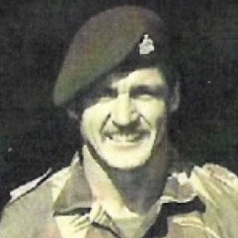 Mike West in beret, smiling portrait