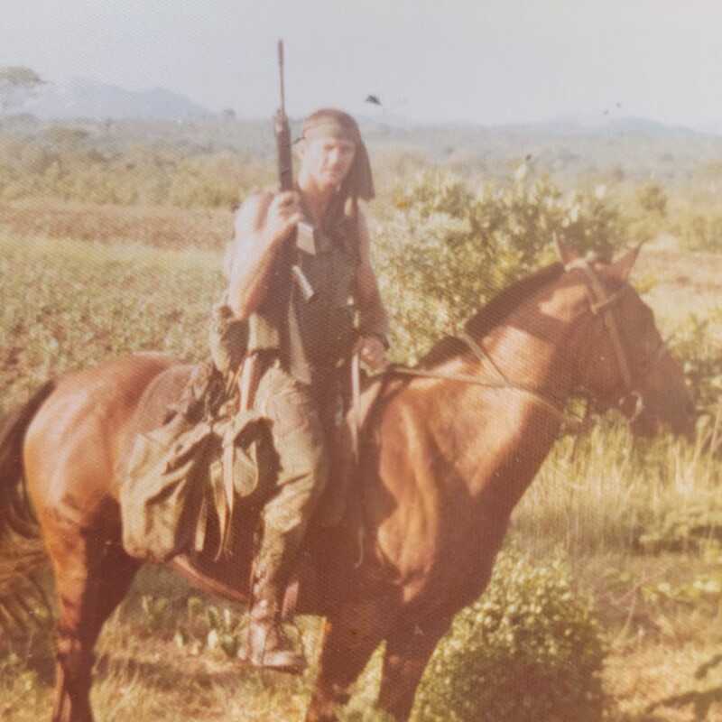 Mike West mounted on horseback during Grey Scouts service